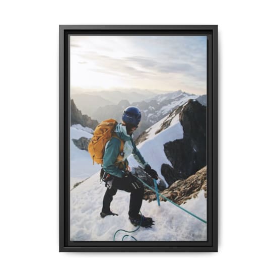 Mountain climber ascending snowy peaks with safety gear and ropes, showcasing mountaineering skills and adventure spirit.