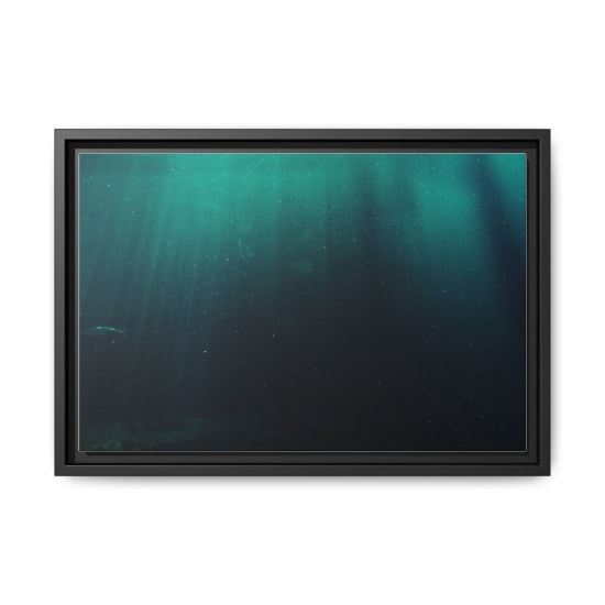 Explore the captivating underwater scene with mesmerizing sunlight rays penetrating the deep sea.