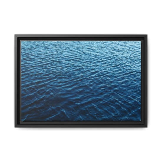 A calming view of dark blue ocean waves on a serene day outdoors.