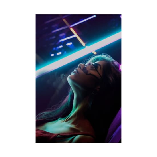 Artistic portrait of a woman with neon lights in São Paulo. Vibrant and energetic night scene.