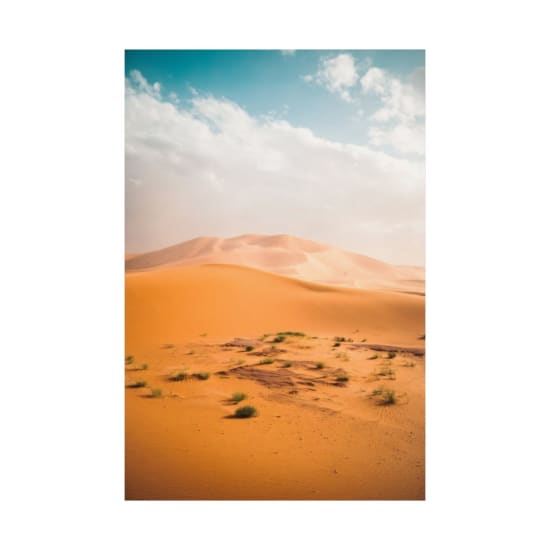 Vast sand dunes under a bright sky in Egypt's Al Wahat Al Dakhla Desert.