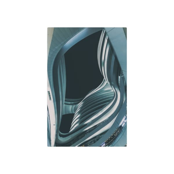 Low angle view of modern Milky Way Soho in Beijing at dusk. Futuristic curves and lines in dramatic urban setting.