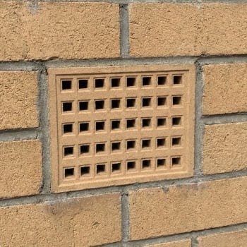 215mm x 140mm buff air brick in a wall