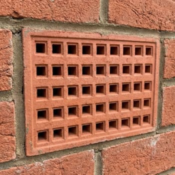 215mm x 140mm red air brick in a wall