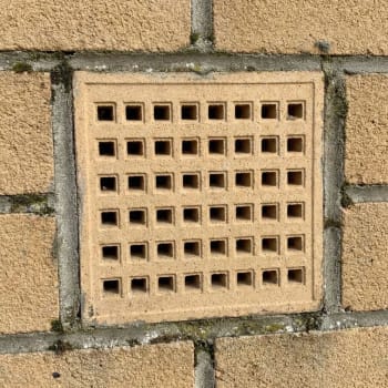 215mm x 215mm buff air brick in a wall
