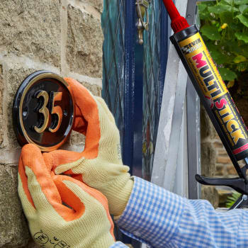 using everbuild multi stick adhesive to fix door number