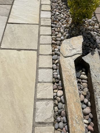 edge of mint indian sandstone paving installed