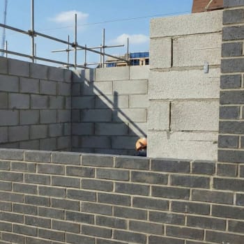 blue smooth engineering bricks in a cavity wall