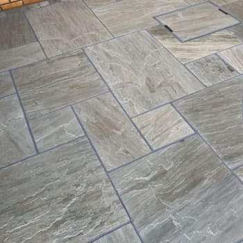 light grey indian sandstone paving patio