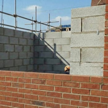 red smooth engineering bricks in a cavity wall