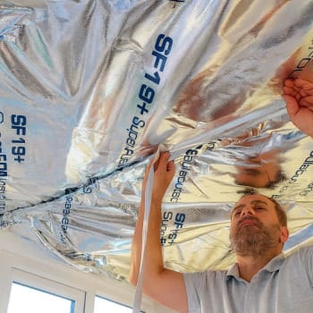 worker installing superfoil sf19 insulation