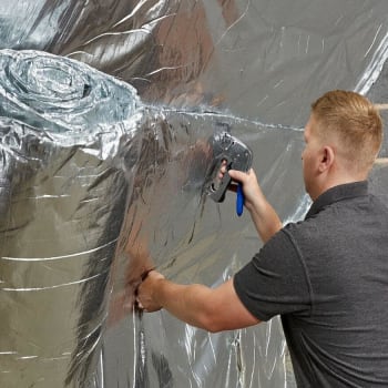 worker installing ybs insulation