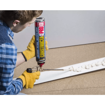 applying constructa pro adhesive to skirting
