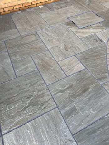 close up of khandla grey indian sadnstone patio installed