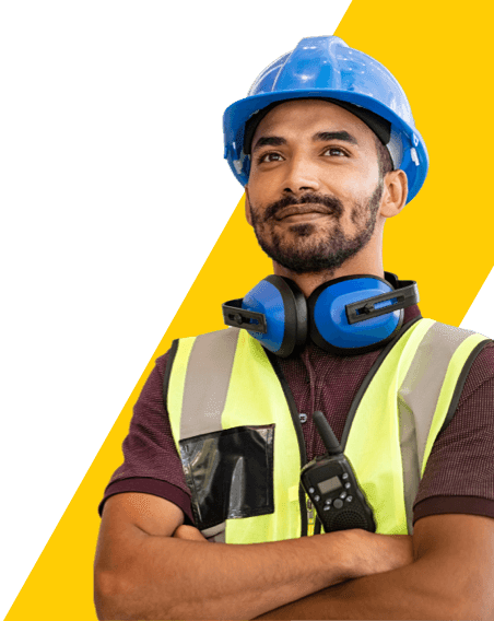 Trade person with crossed arms, and ear defenders round his neck