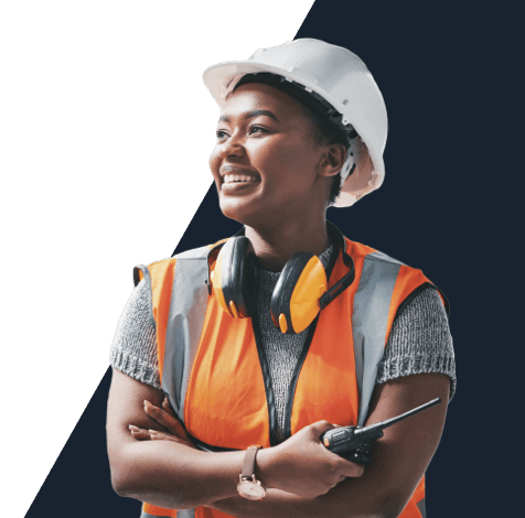 Smiling trade person, wearing a hard hat