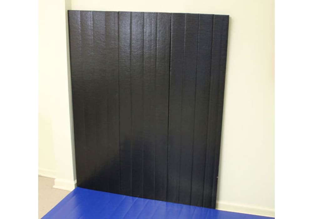 Is it Better to Use Wood-backed Wall Pads or Roll-out Mats?