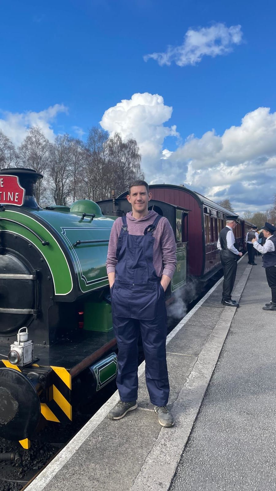 Matt stood next to a steam train at Peak Rail in Derbyshire