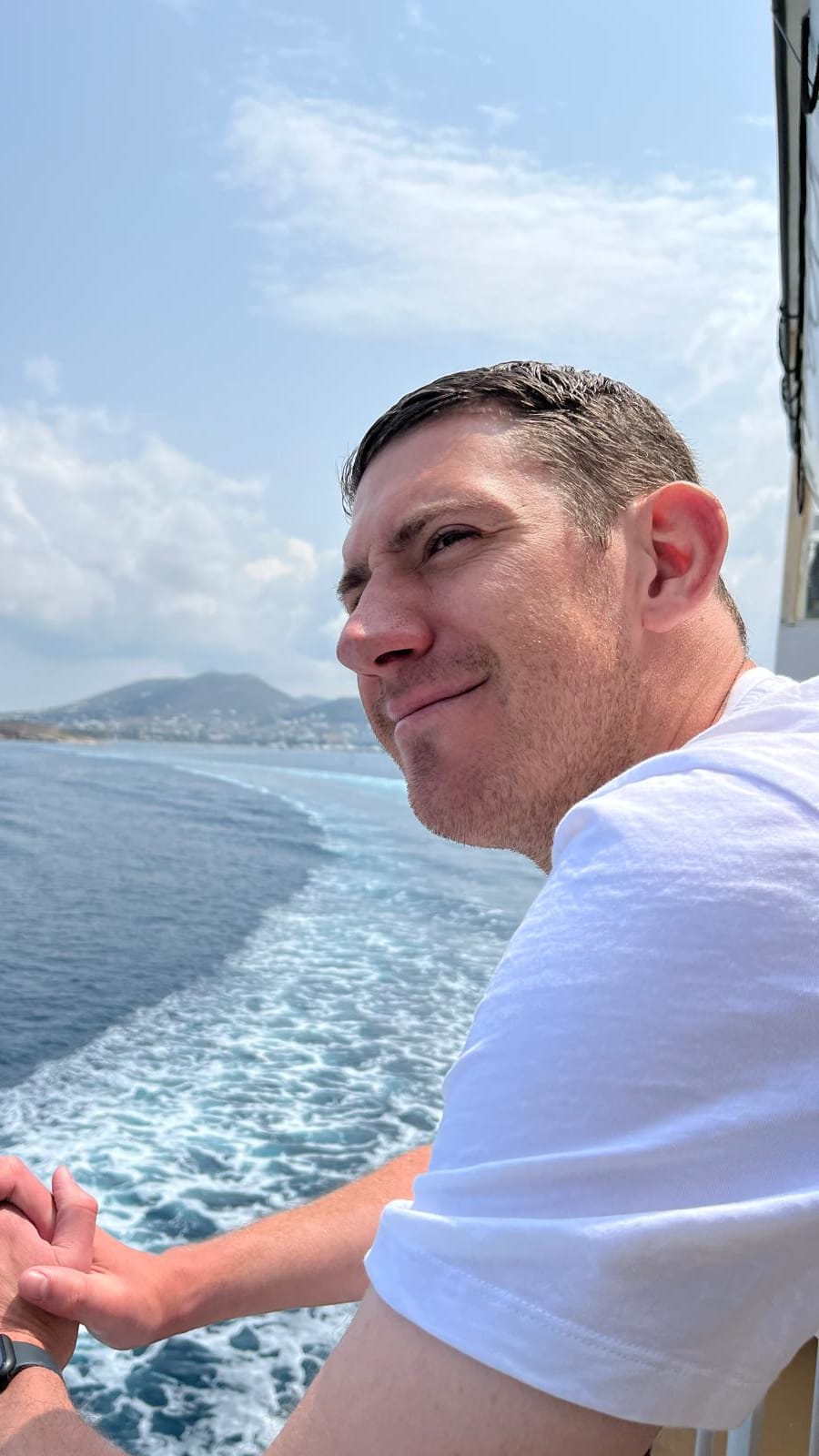 Matt stood on a ferry in the Cyclades Islands