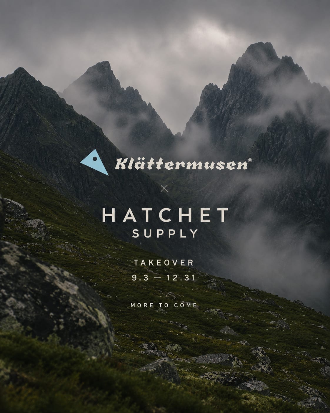 A rocky, moss-covered foreground leads to a dramatic, misty mountain range in the background, with the Klättermusen and Hatchet Supply logos overlaid.