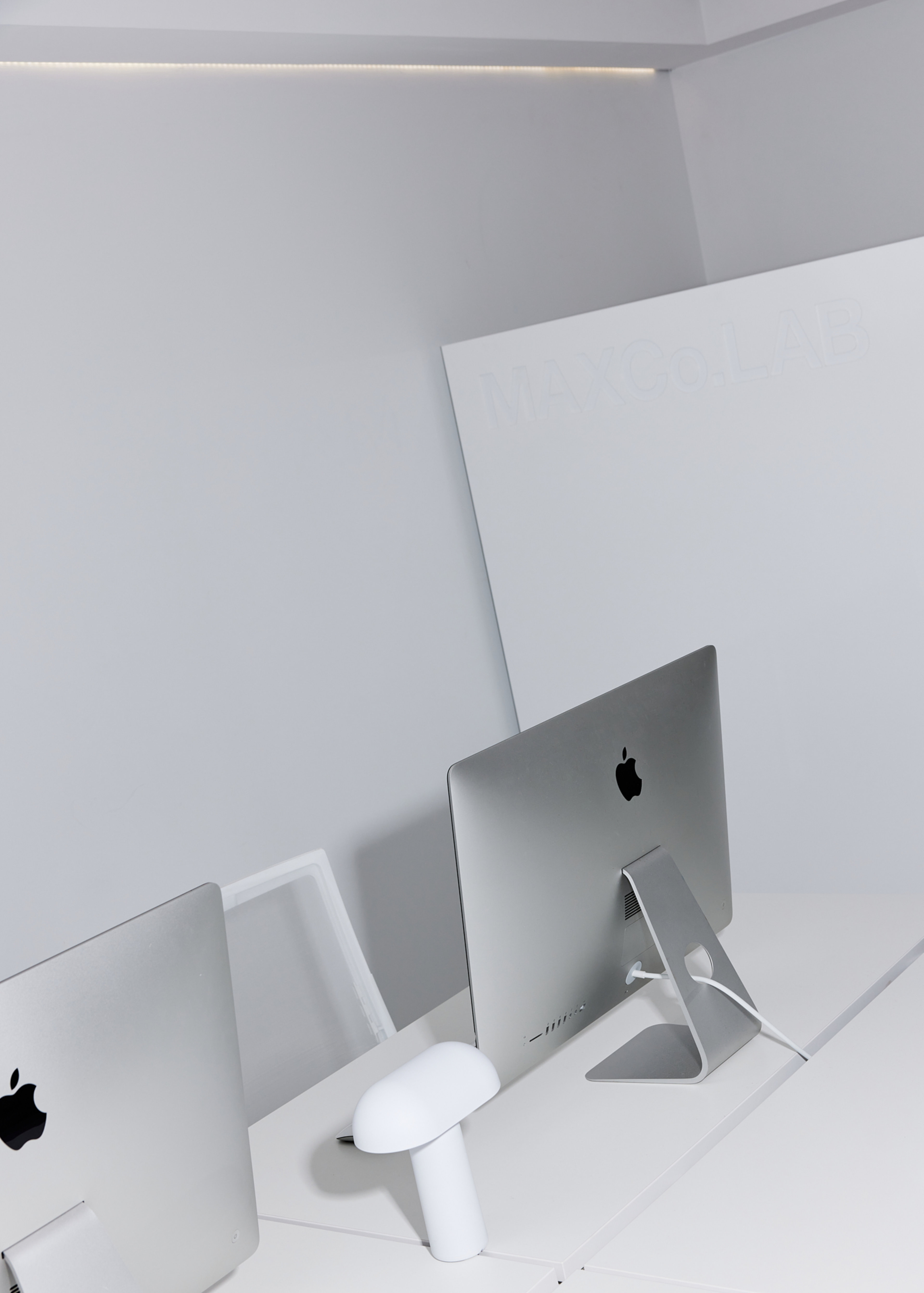 Two computers on desk in MAXCo.LAB Queensland office.