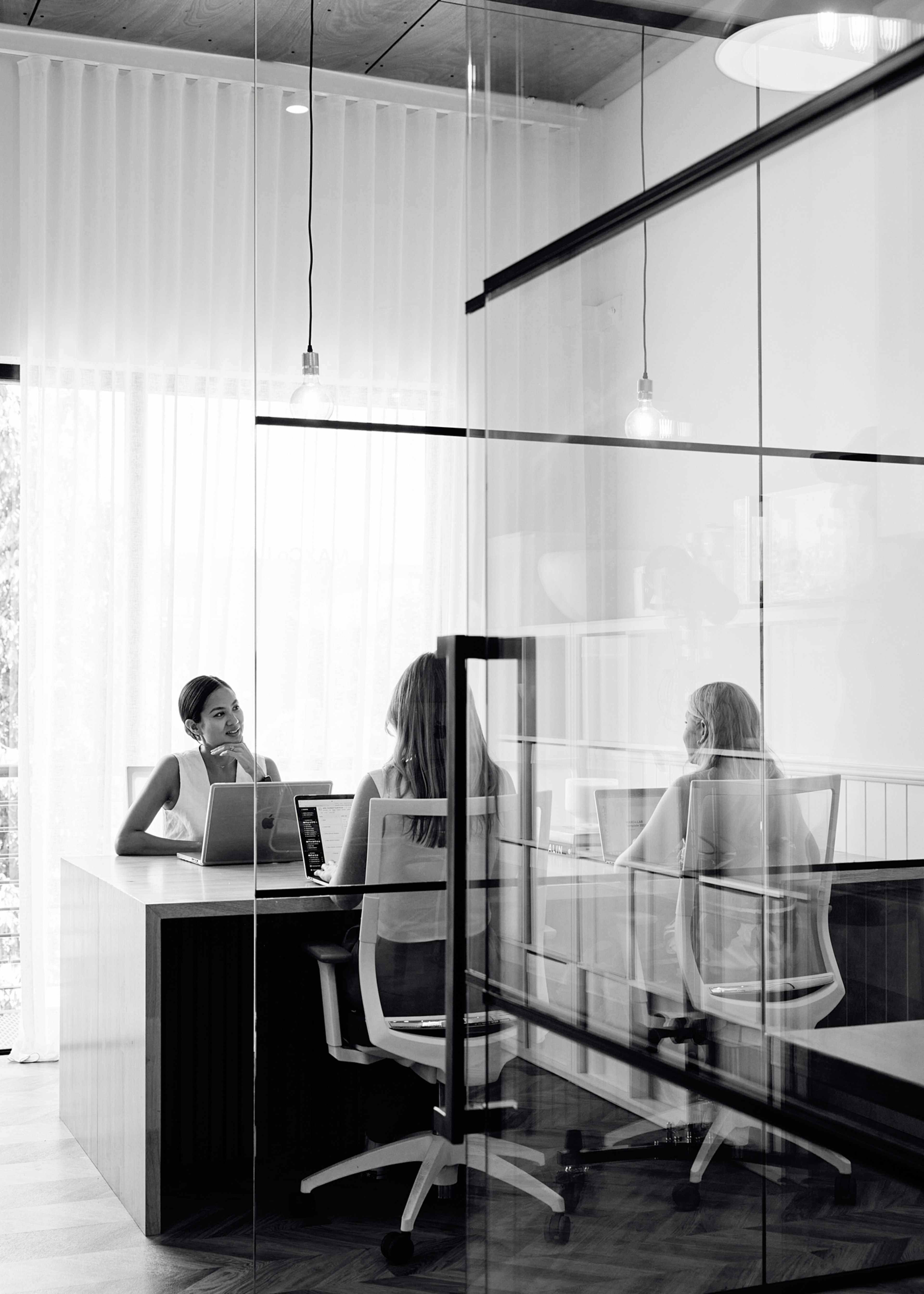 People working in MAXCo.LAB office.