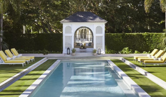 Image of pool with duVal Sun Chaises in a yellow fabric poolside on the grass