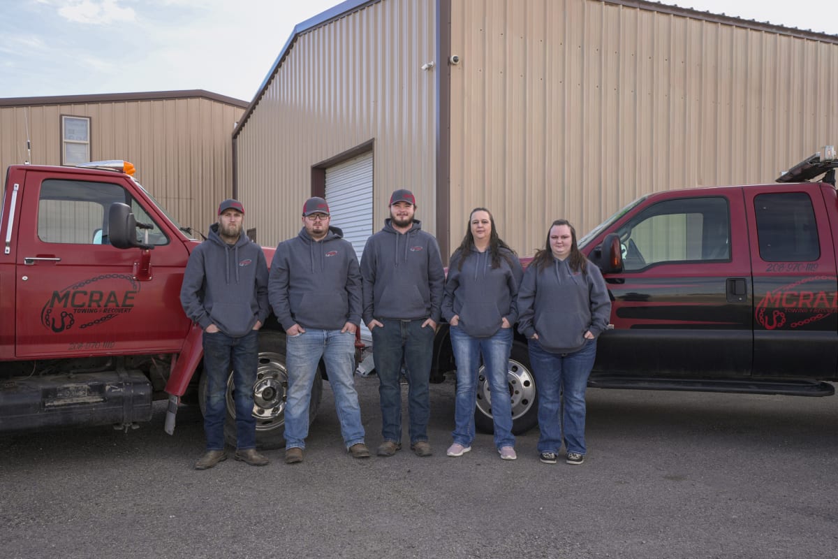 A professional photograph of the owner and the team of McRae Towing and Recovery.