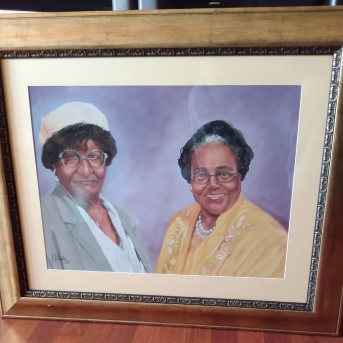A finished commissioned portrait, framed and ready for delivery