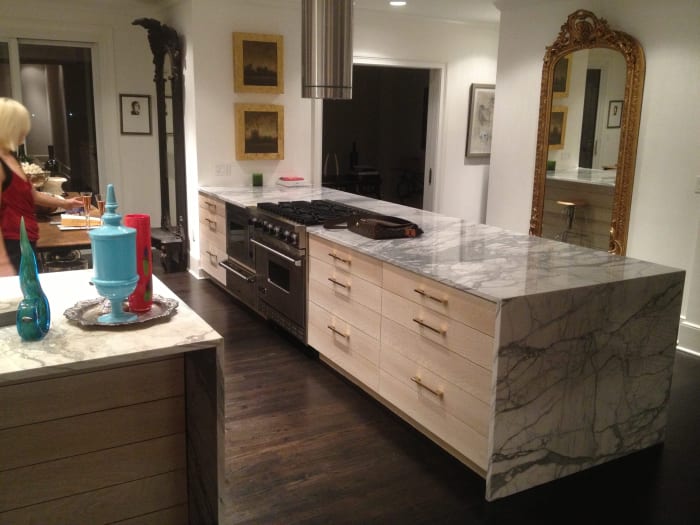 Marble Counters on White Kitchen Cabinets with Gold Accents