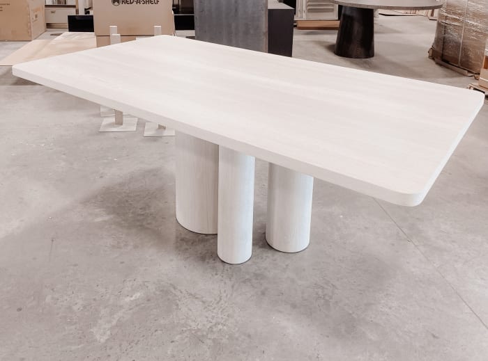 White oak dining table in Ghost white finish