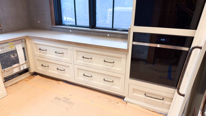 Cream Cabinetry with Cast Concrete Countertops