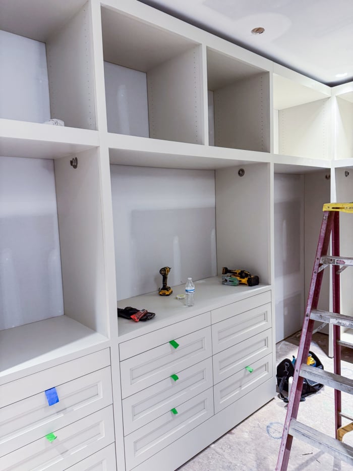 Process of Installing White Built in Shelves in Closet