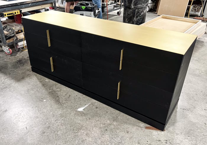Modern Black Dresser with Gold Top and Hardware
