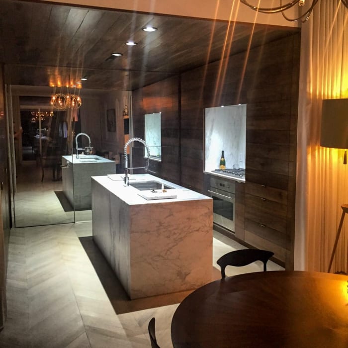 Wooden Cabinets in Marble Countered Kitchen