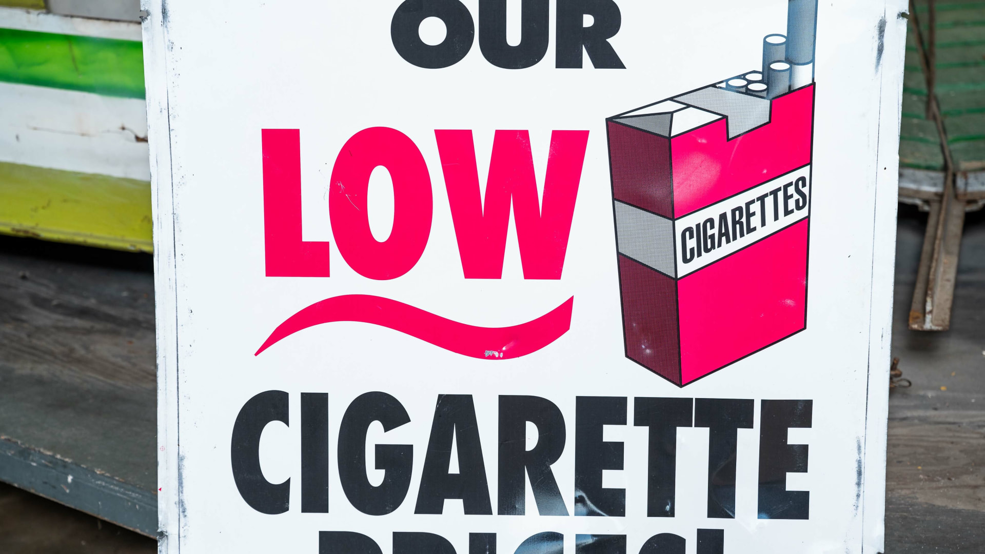 Low Cigarette Prices DoubleSided Tin Sign at Elmer's Auto & Toy Museum