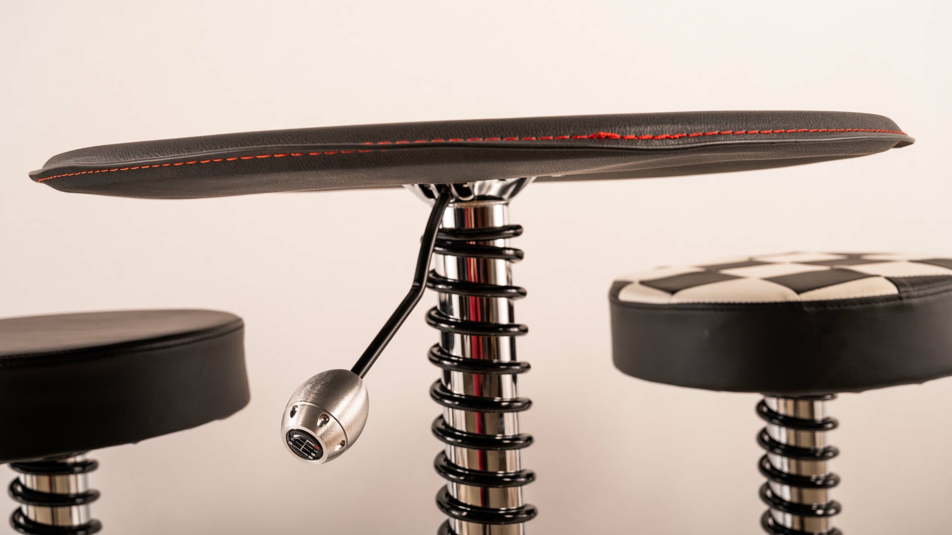 Shock Absorber Table and Stools at Indy Road Art 2022 as M420 Mecum