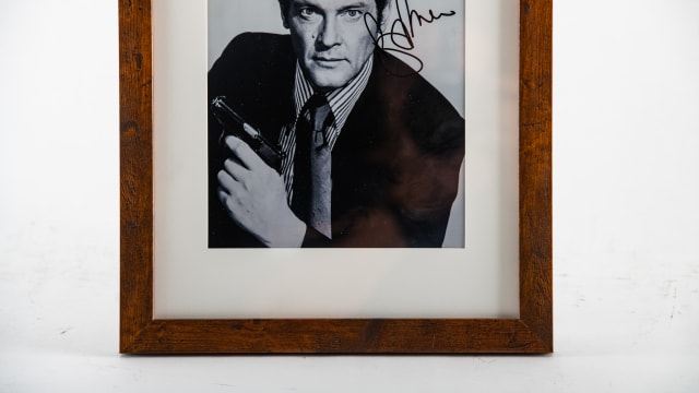 Roger Moore Signed Photograph at Indy 2023 as Z607 - Mecum Auctions