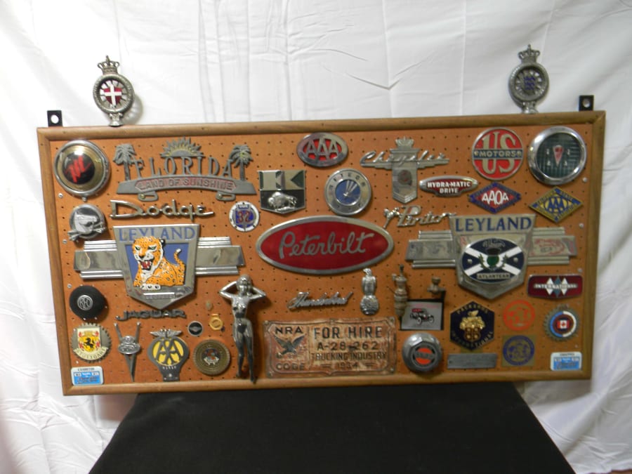 Board With Mounted Grill Emblems And Memorabilia for Sale at Auction