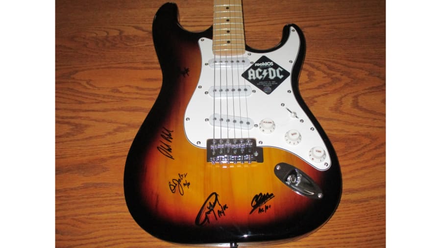 ACDC Autographed Guitar at Kissimmee 2016 as B12 - Mecum Auctions
