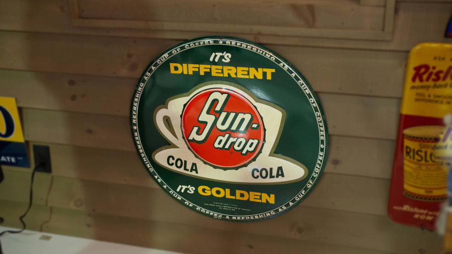Sundrop Cola Embossed Tin Round Sign at The Eddie Vannoy Collection