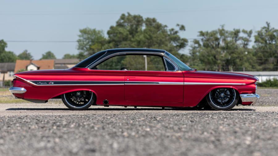 August 05 2016: Beautiful 1961 Chevy Impala with Candy Brandywine paint  scheme at the 30th Anniversary of the Hot August Nights Custom Car Show the  largest nostalgic car show in the world