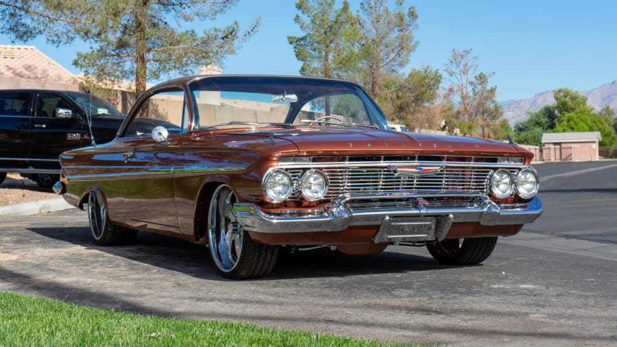 August 05 2016: Beautiful 1961 Chevy Impala with Candy Brandywine paint  scheme at the 30th Anniversary of the Hot August Nights Custom Car Show the  largest nostalgic car show in the world