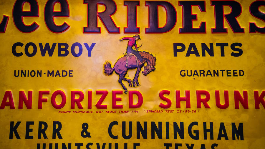 Lee Riders Cowboy Pants Single-Sided Framed Embossed Tin Sign For