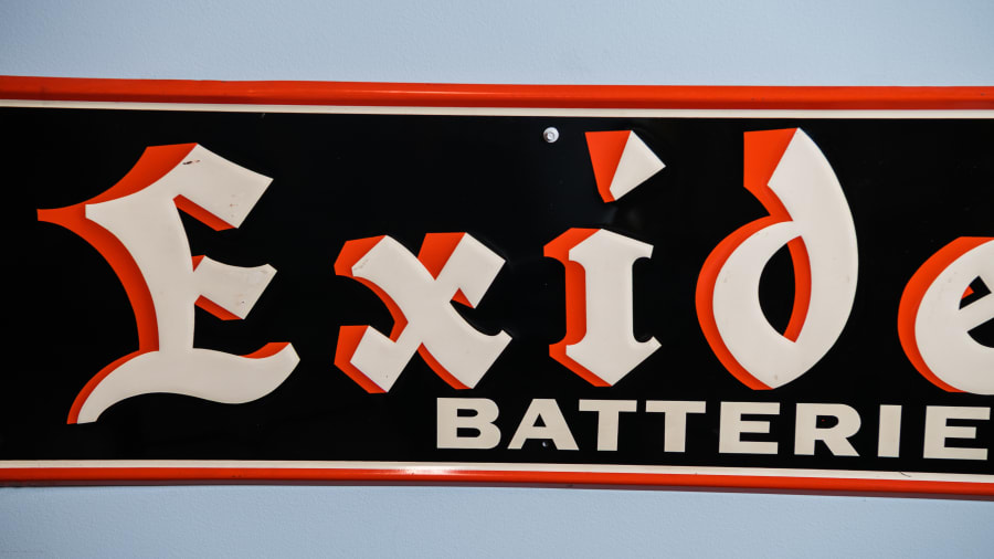 1957 Exide Batteries Single-Sided Embossed Tin Sign For Sale At