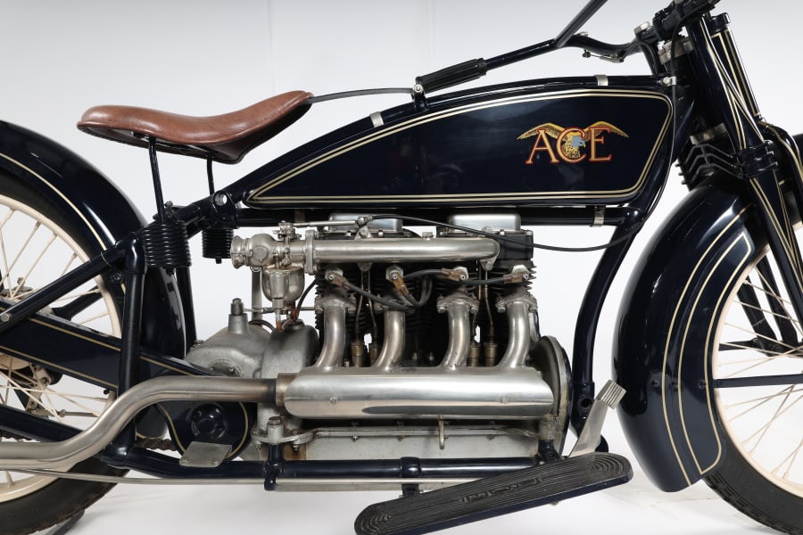 From Two To Four Wheels. A motorcycle ace now on four wheels, John