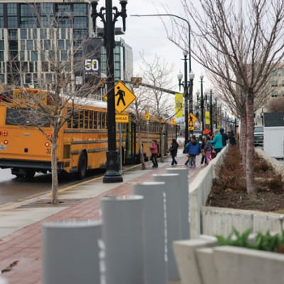 Bus offloading students to the Jazz game