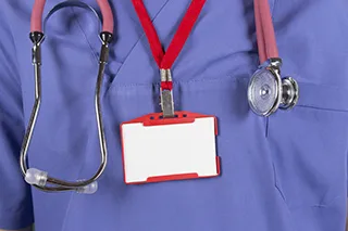 Nurse Putting On Nametag