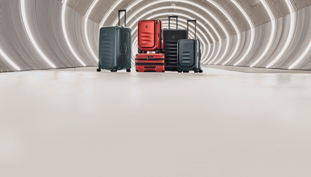 A group of luggage in a tunnelDescription automatically generated