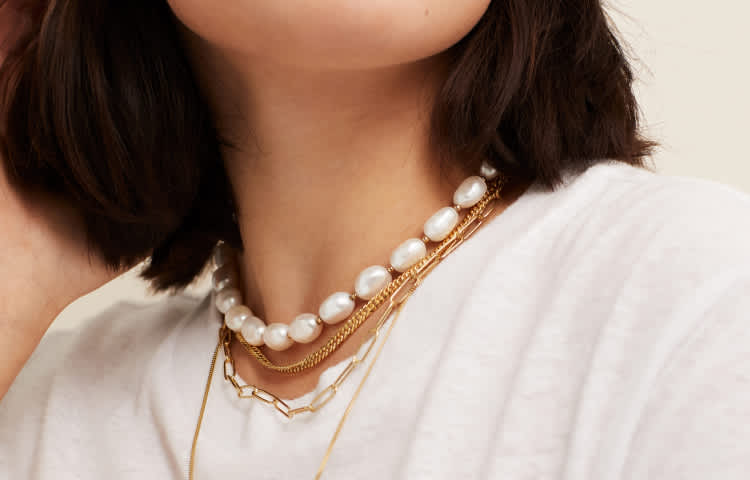 Pendant Necklace This icebox diamond letter pendant is made of 14k yellow gold with 0.10ctw of diamonds.